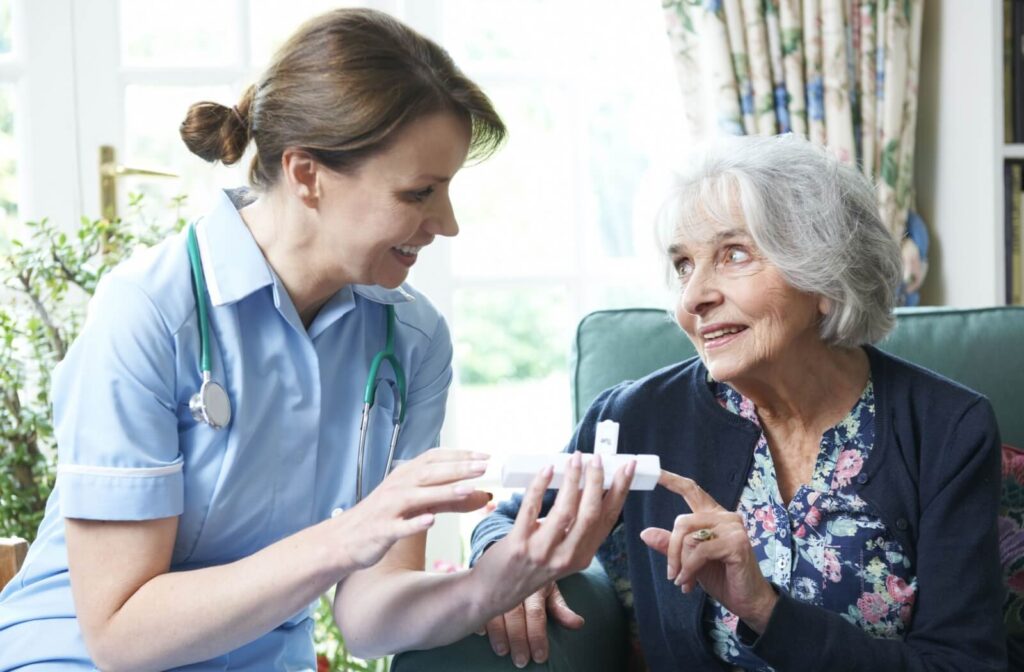 A nurse aids a senior with ensuring their medication is taken regularly while the community prepares for hurricane season