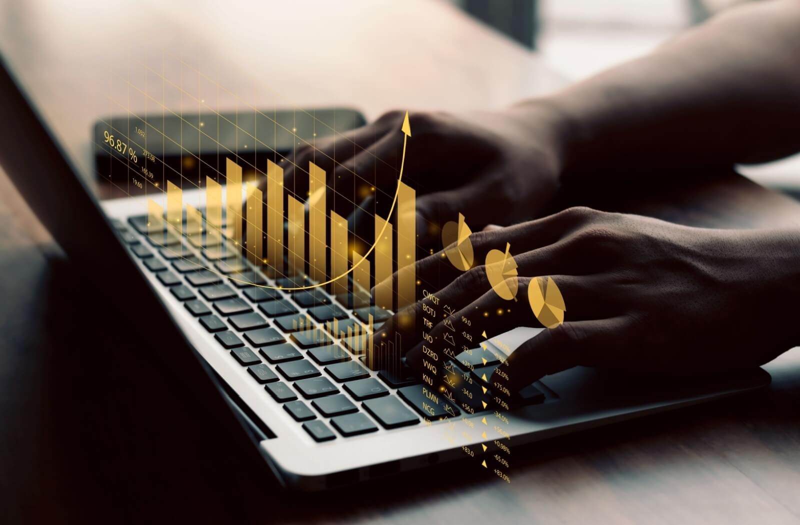 a person types at a computer. charts appear over the keyboard showing upwards profit from owning an assisted living community
