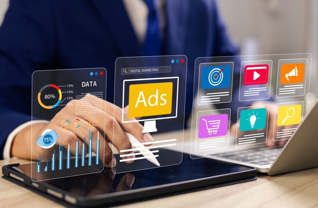 Digital marketing, social media ads, and other online promotion strategies emerge from a computer and tablet, targeting customers and boosting engagement through SEO, AI, and Data